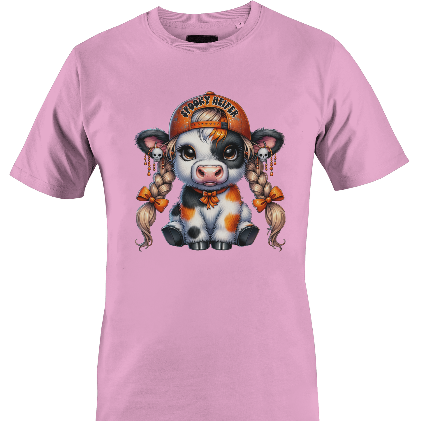 A light pink short-sleeve crewneck t-shirt featuring a colorful graphic of a cute cartoon cow wearing an orange baseball cap with the text 'spooky heifer' by Monkey's Creations.