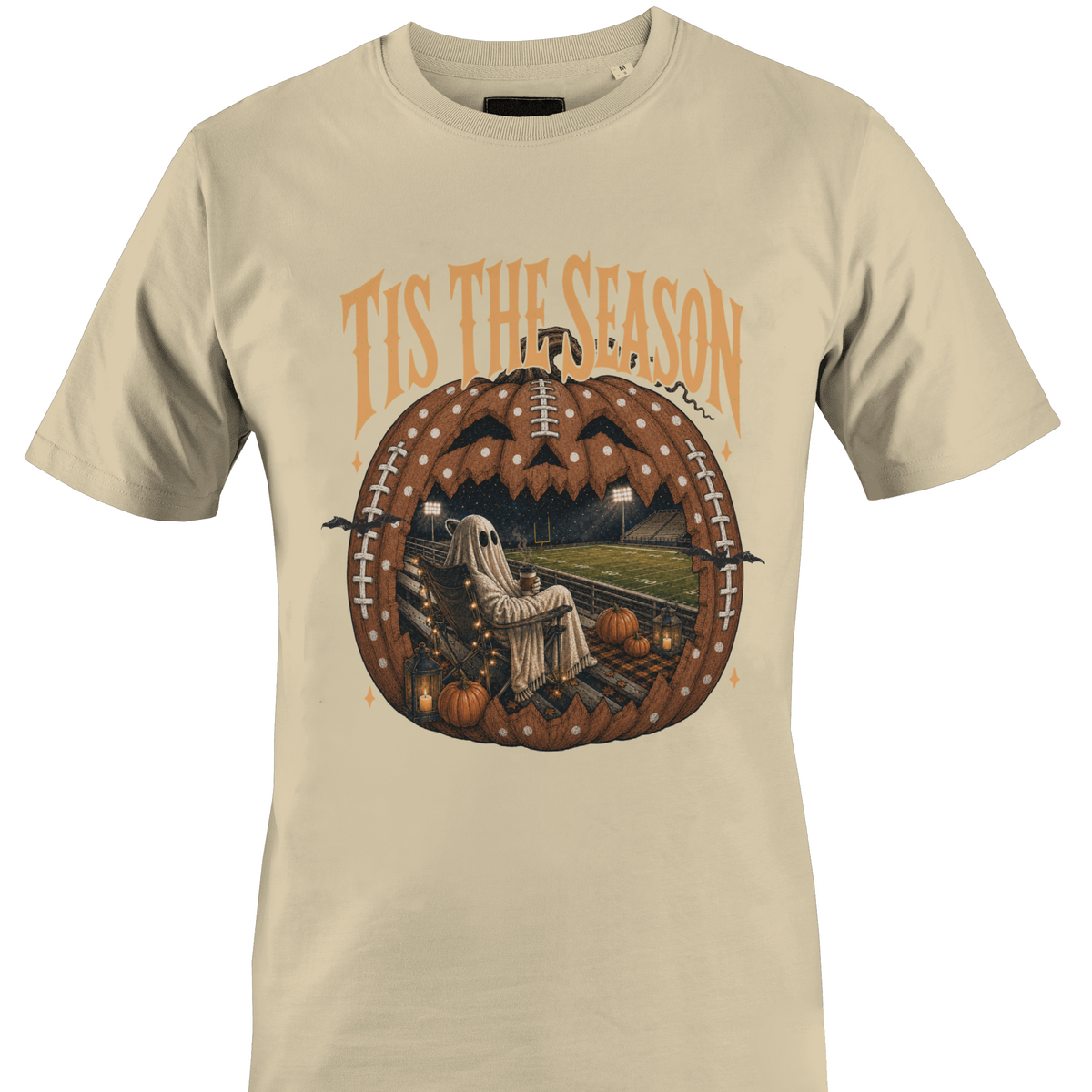 Tan t-shirt by Monkey's Creations featuring a ghost in a chair inside a Jack O Lantern with Halloween elements. 