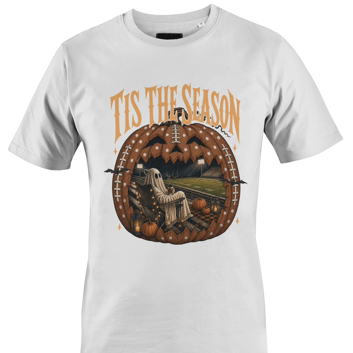 White t-shirt by Monkey's Creations featuring a ghost in a chair inside a Jack O Lantern with Halloween elements. 