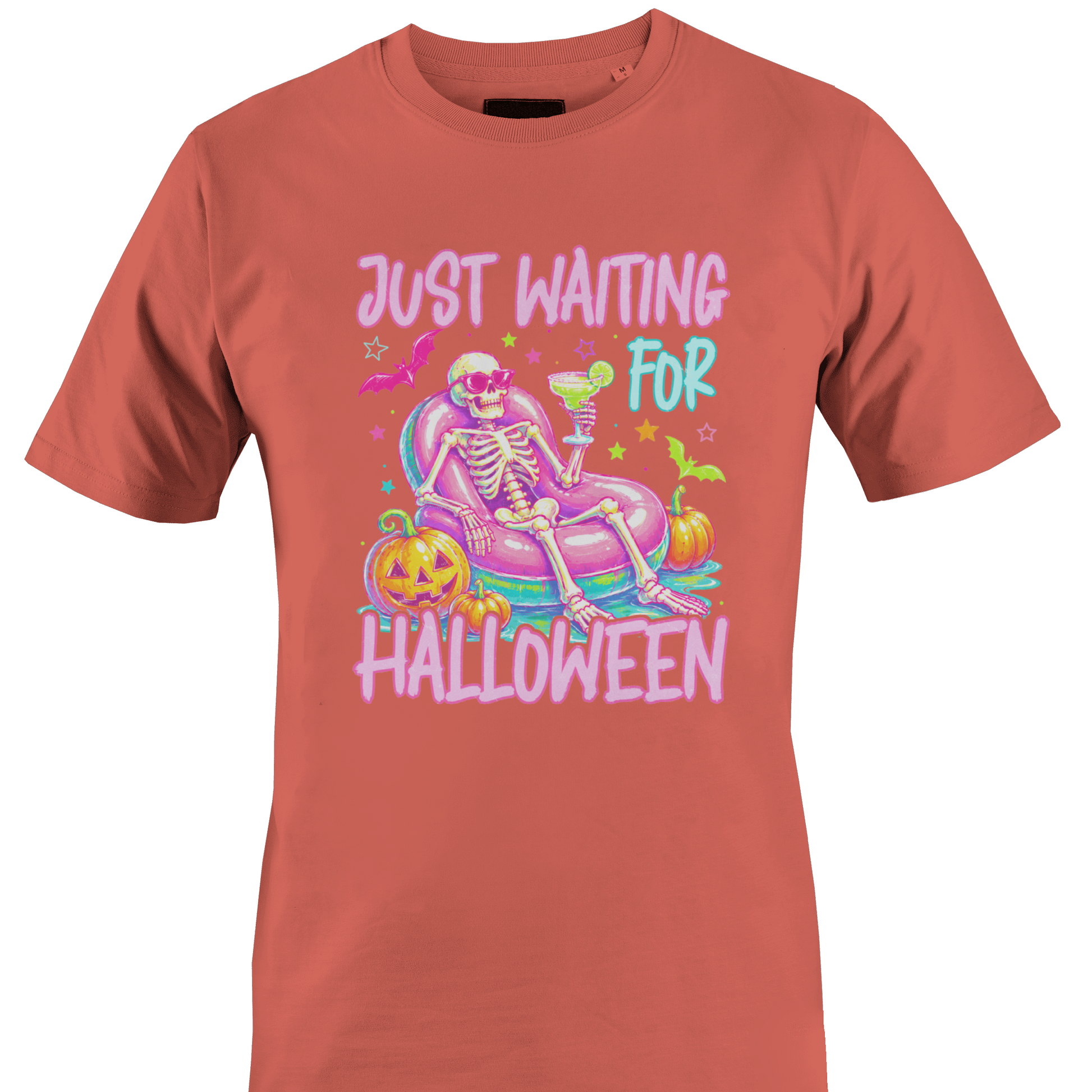 Coral t-shirt with a colorful skeleton on a pool floatie with Halloween elements and text 'Just Waiting for Halloween' by Monkey's Creations. 