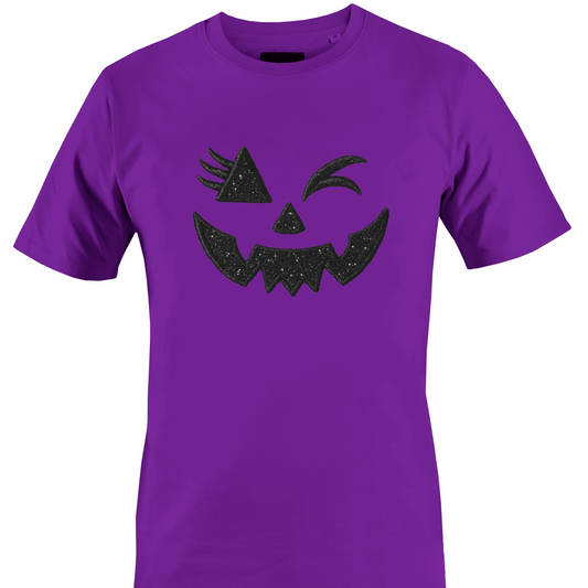 Dark purple t-shirt with a glitter bling winking jack o lantern eyes and face for Halloween by Monkey's Creations. 