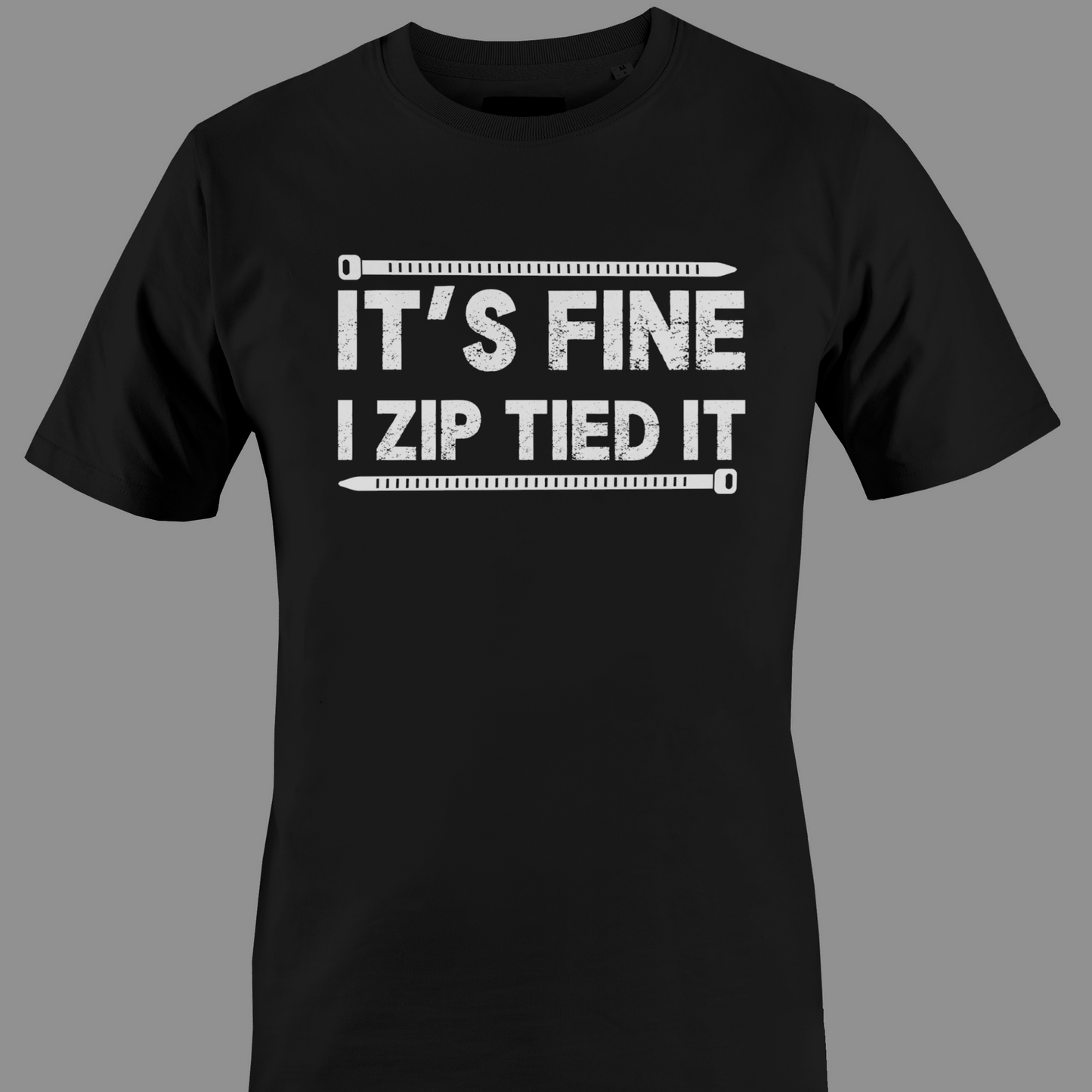 Black t-shirt with white text 'IT'S FINE I ZIP TIED IT' 