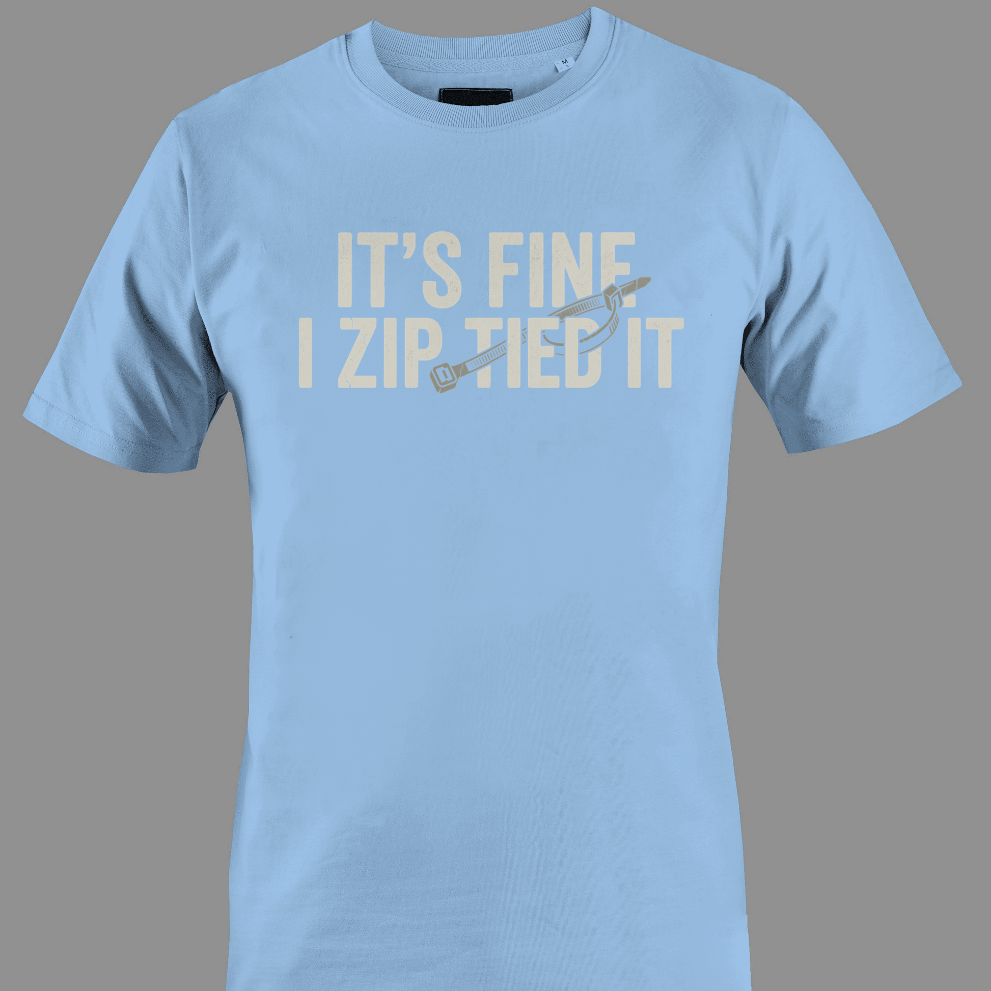 Light Blue t-shirt with white text 'IT'S FINE I ZIP TIED IT' 
