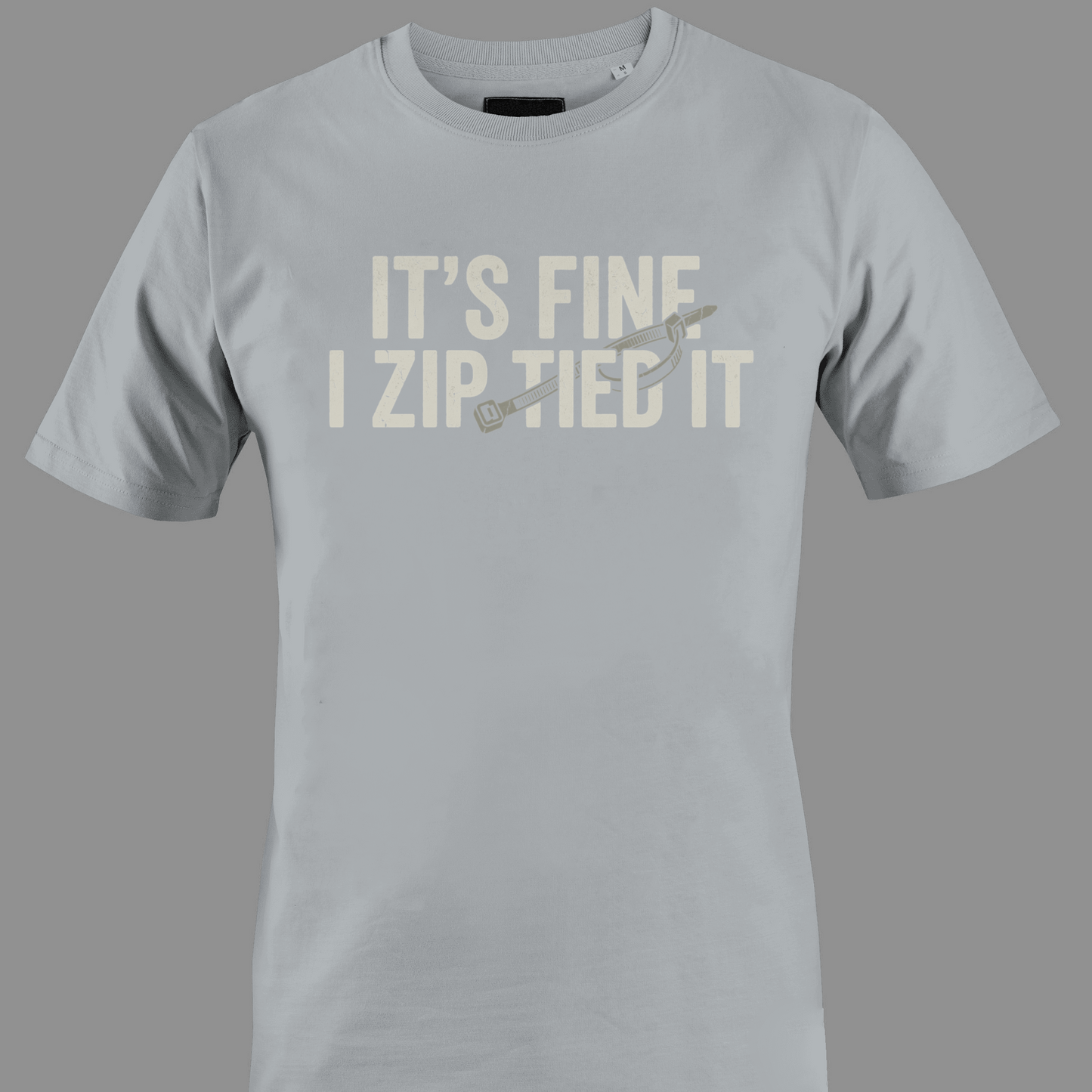 Light gray  t-shirt with white text 'IT'S FINE I ZIP TIED IT' 