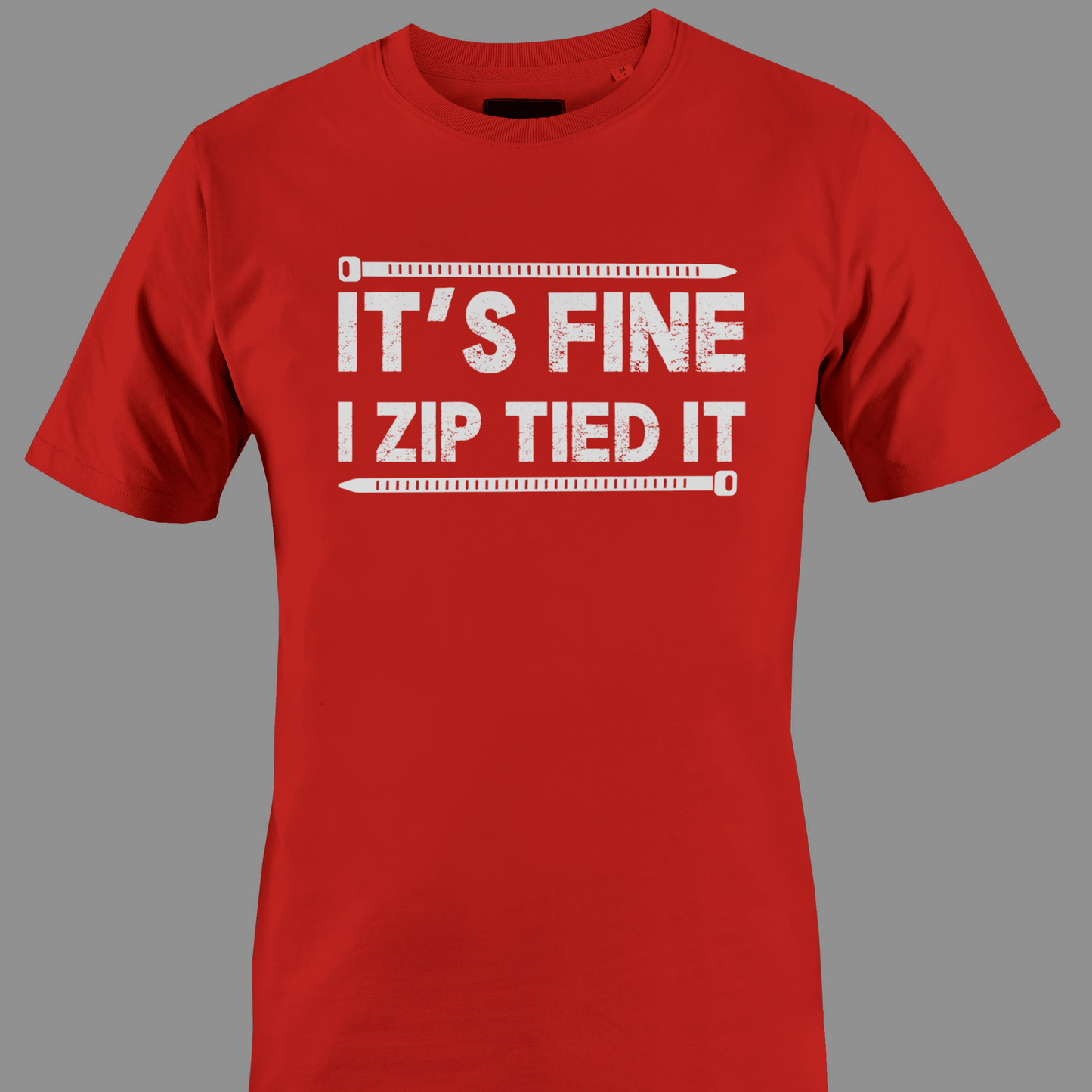 Red t-shirt with white text 'IT'S FINE I ZIP TIED IT' 