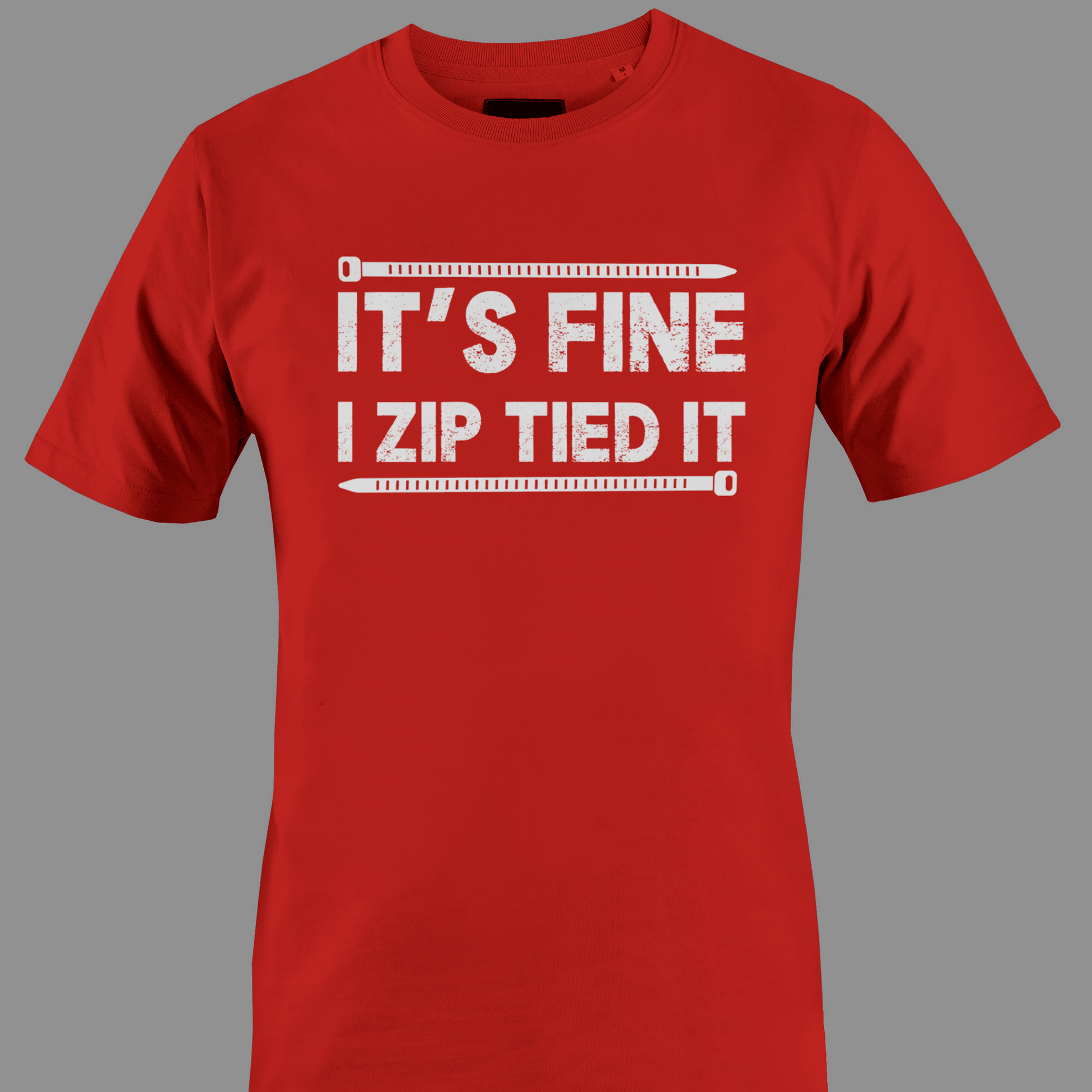 Red t-shirt with white text 'IT'S FINE I ZIP TIED IT' 