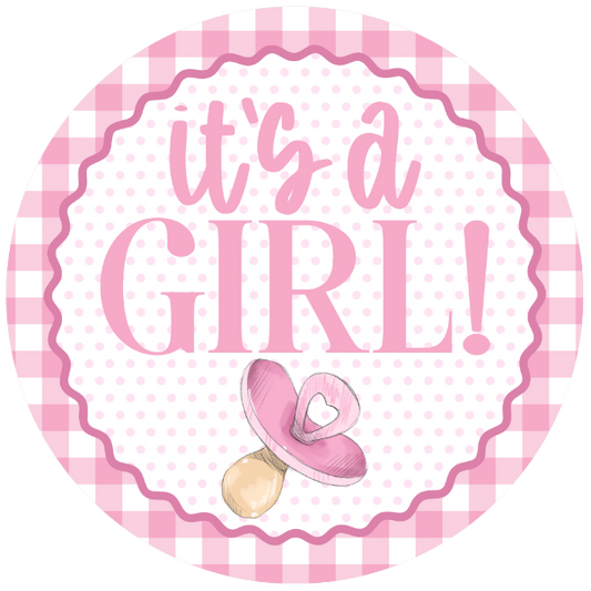 Girl check round wreath sign with text 'it's a girl!' and a pacifier 