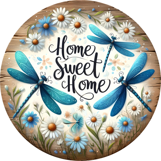 Blue dragonflies, white and blue daisies with text 'Home Sweet Home' on a wooden background.