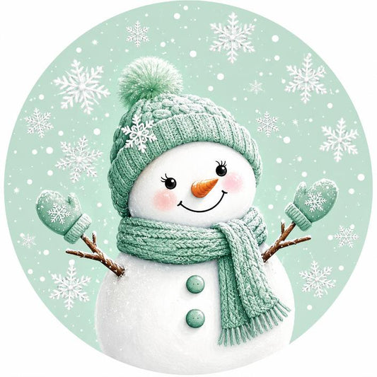 Round metal wreath sign with a mint green themed snowman and background by Monkey's Creations. 