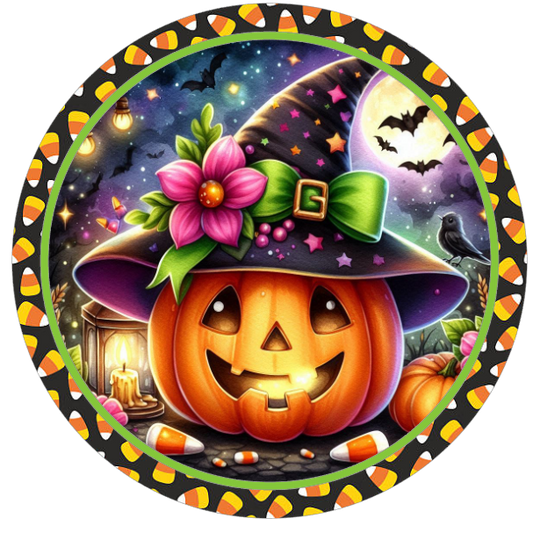 Halloween pumpkin in a witch hat and colorful decorations and candy corn