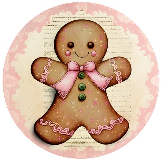 Round metal wreath sign with a pink adorned gingerbread girl cookie by Monkey's Creations.