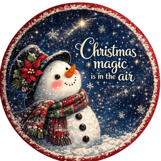 Round metal wreath sign featuring a snowman with the text "Christmas magic is in the air" by Monkey's Creations.