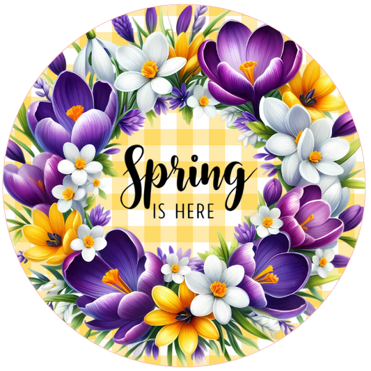 Circular wreath sign with spring flowers and 'Spring is here' text 