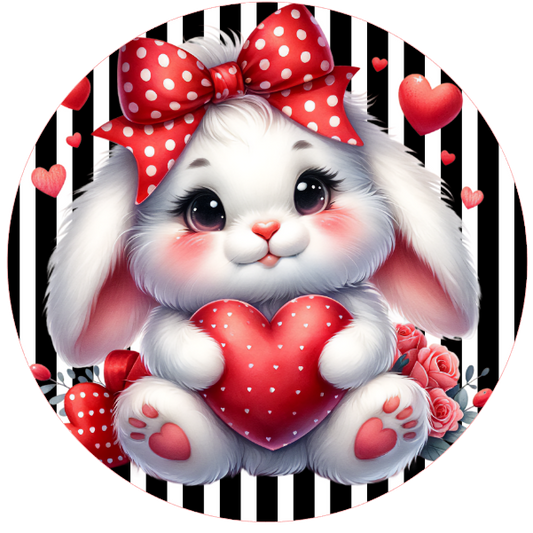Valentine metal wreath sign cartoon bunny holding a heart with a polka dot bow on a black and white striped background