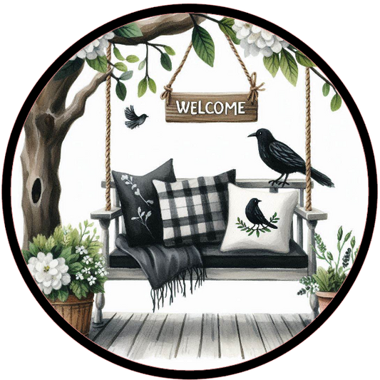 Swing, pillows, and a 'Welcome' sign under a tree.