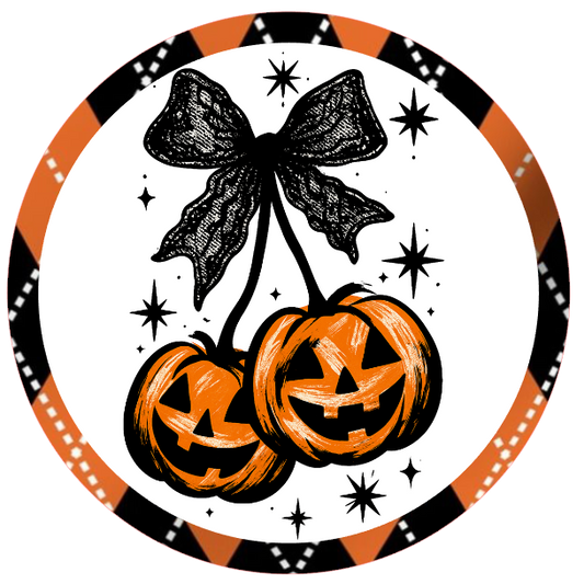 Halloween-themed design with pumpkins, a bow, and decorative elements