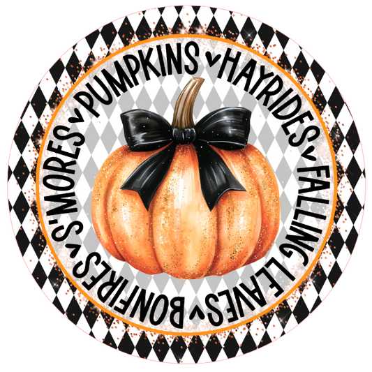 Pumpkin with a black bow surrounded by autumn-themed text 