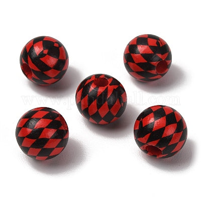 Red painted round wooden beads with a black harlequin design for crafting and wreath making carried by Monkey's Creations.