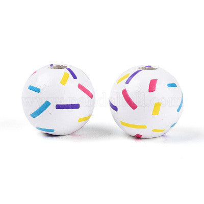 Painted white wooden beads with multicolor confetti for crafting and wreath making.