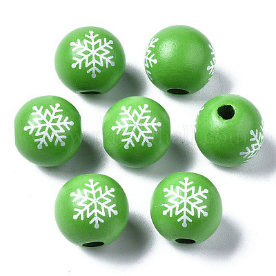 Painted green and white snowflake wooden beads for crafting and wreath making