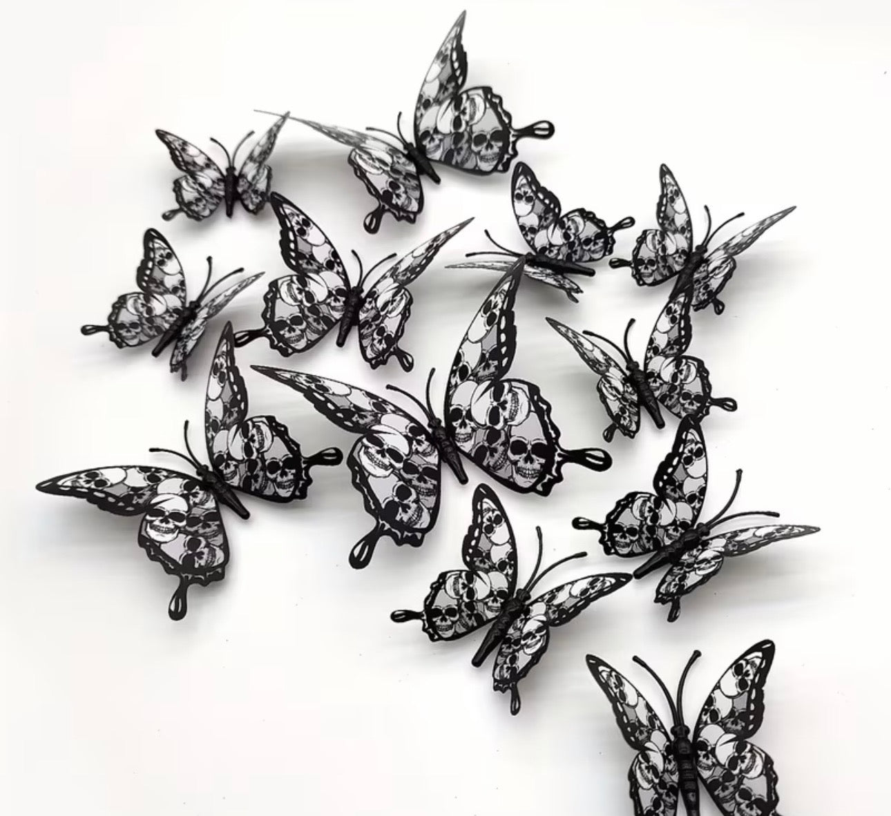 Black and white butterflies with skulls in shades of grey and white, wreath accent supplies carried by Monkey's Creations.