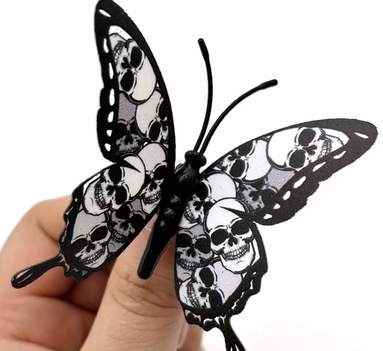 Black and white butterfly with skulls in shades of grey and white, wreath accent supplies carried by Monkey's Creations.