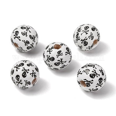 White painted round wooden beads with black skull and cross bones for crafting and wreath making carried by Monkey's Creations.