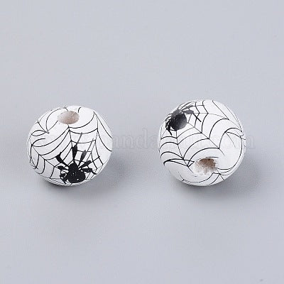 Painted white wooden beads with black cobwebs and spiders for crafting and wreath making. 