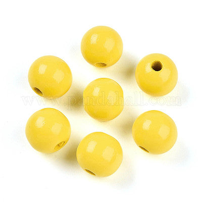 Painted bright yellow wooden beads for crafting and wreath making