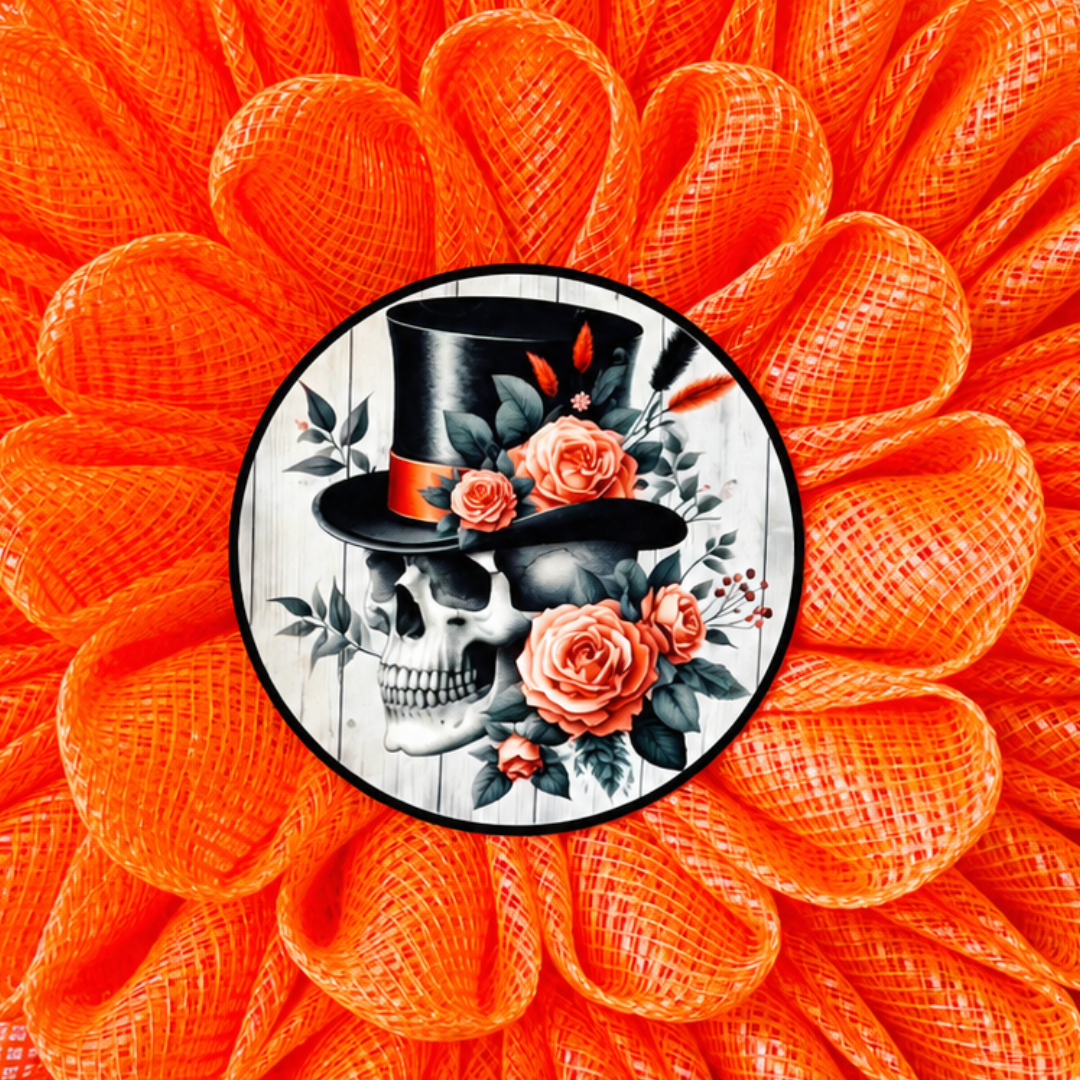 An orange deco mesh 3D flower wreath with a skull and roses center for Halloween by Monkey's Creations.