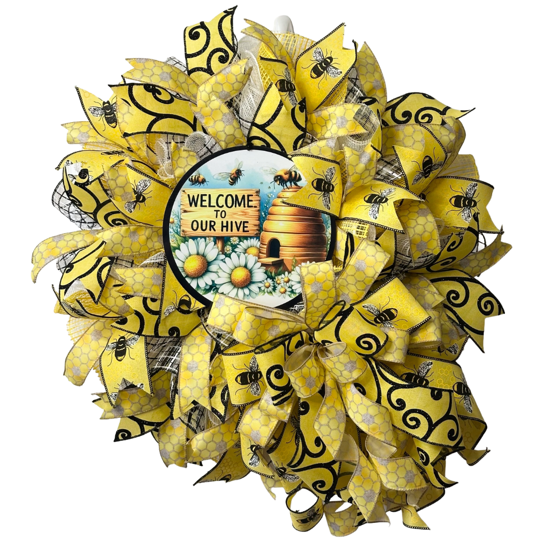 Deco mesh and ribbon wreath with yellow and black bee design, featuring a 'Welcome to Our Hive' wreath sign designed by Monkey's Creations.
