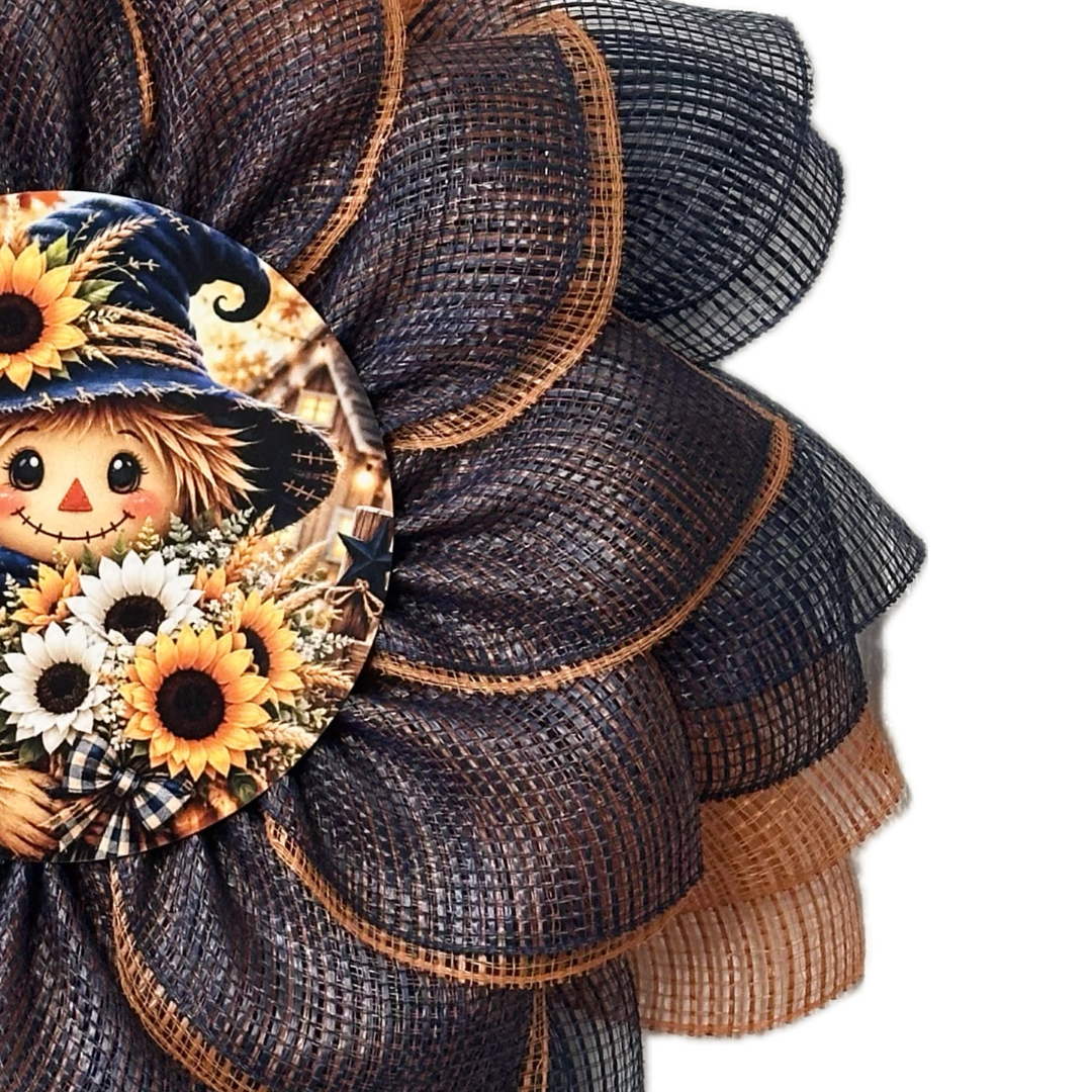 Orange and blue deco mesh flower wreath with a scarecrow center by Monkey's Creations. 