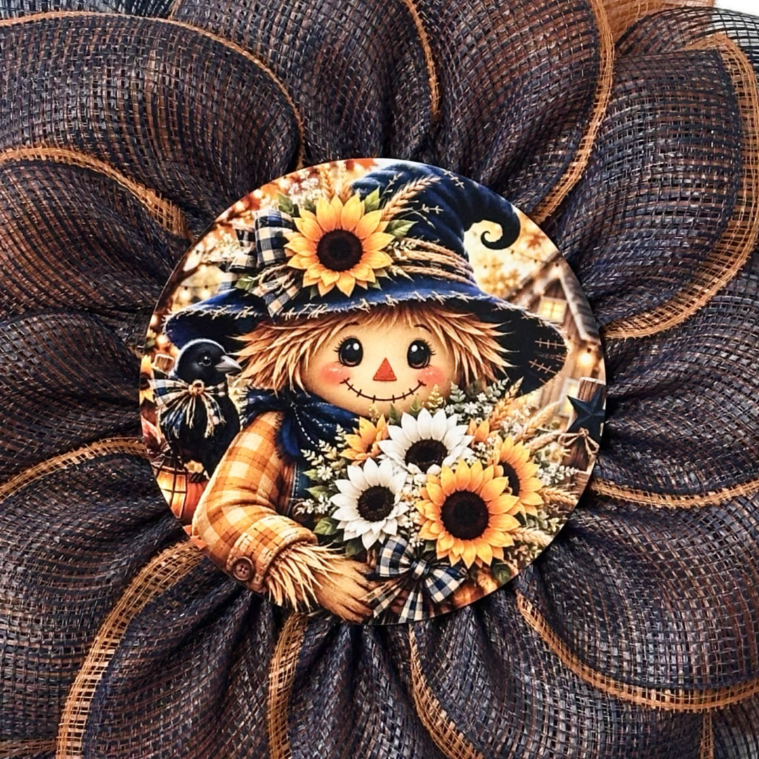 Orange and blue deco mesh flower wreath with a scarecrow center by Monkey's Creations. 