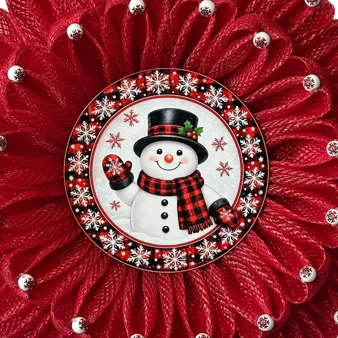 Deco mesh wreath with beaded tips and a wintery buffalo check plaid snowman center by Monkey's Creations.
