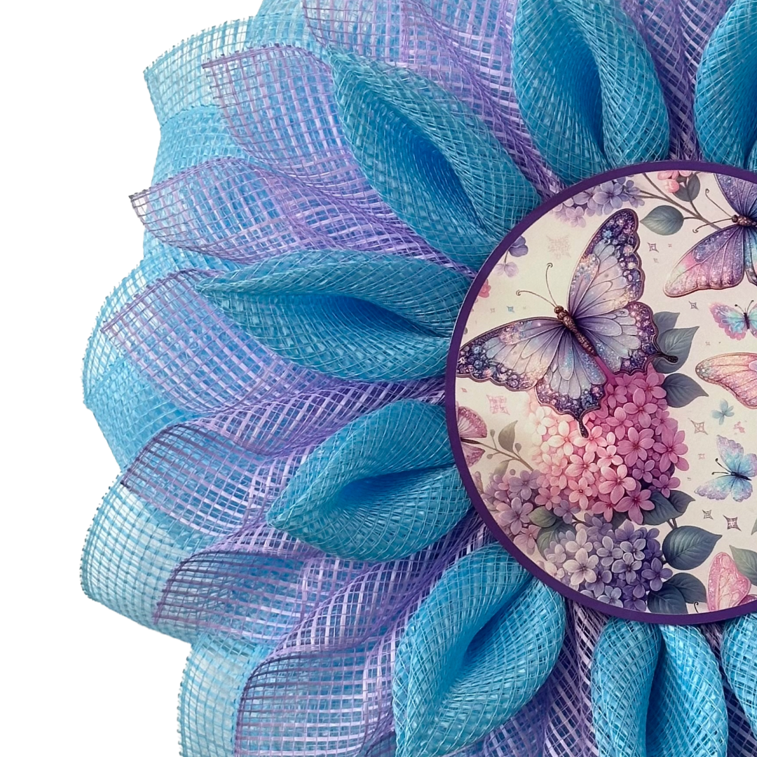 Deco Mesh flower wreath with blue and purple petals and a butterfly metal wreath sign by Monkey's Creations.