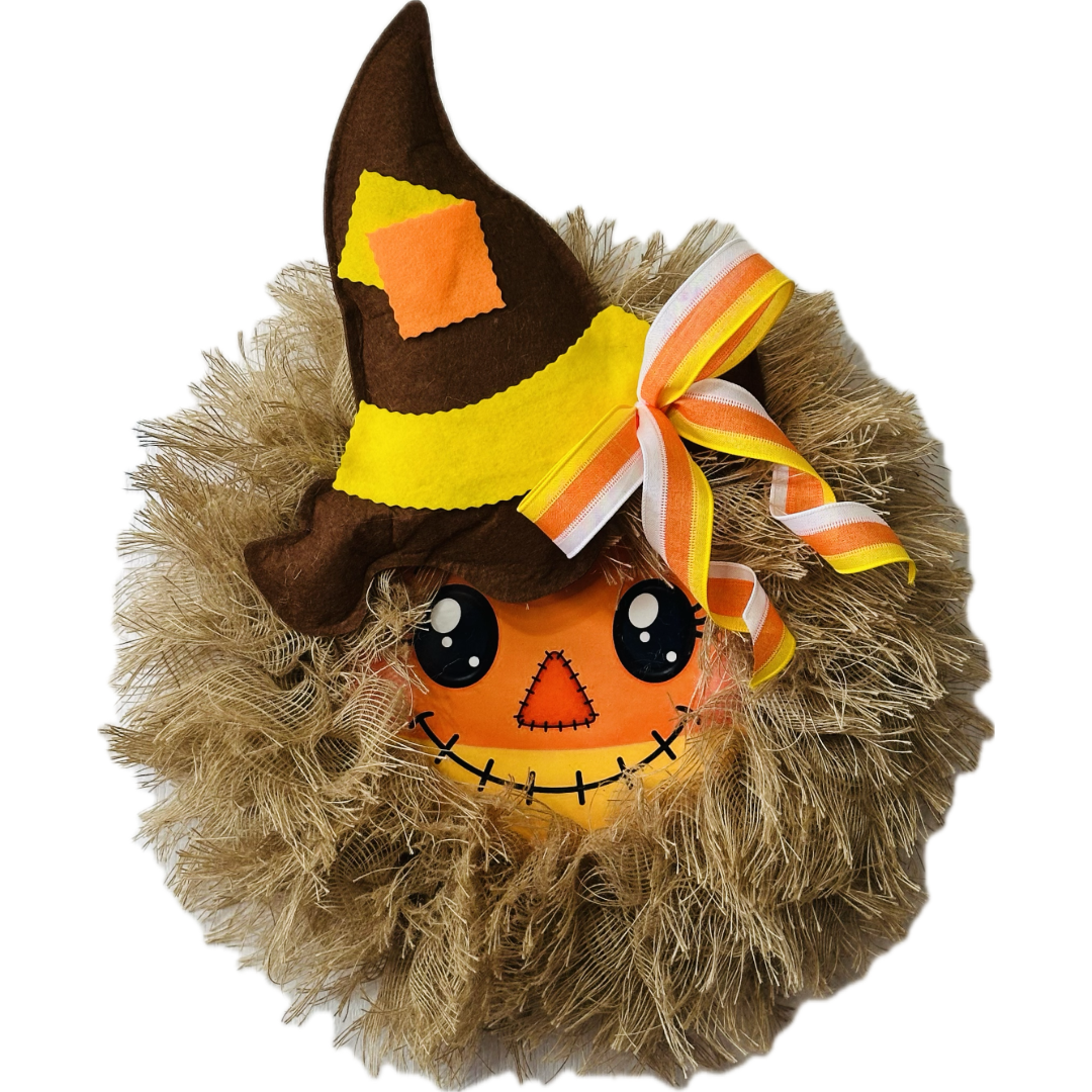 Autumn and Halloween candy corn themed scarecrow wreath with a candy corn scarecrow metal wreath sign center, frayed edge burlap, a felt hat and a candy corn colored bow by Monkey's Creations. 
