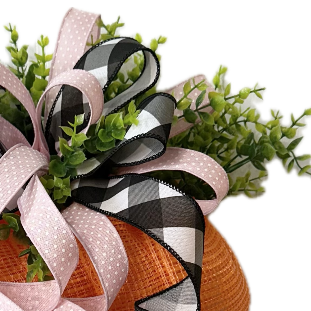 Decorative greenery with a ribbon bow  