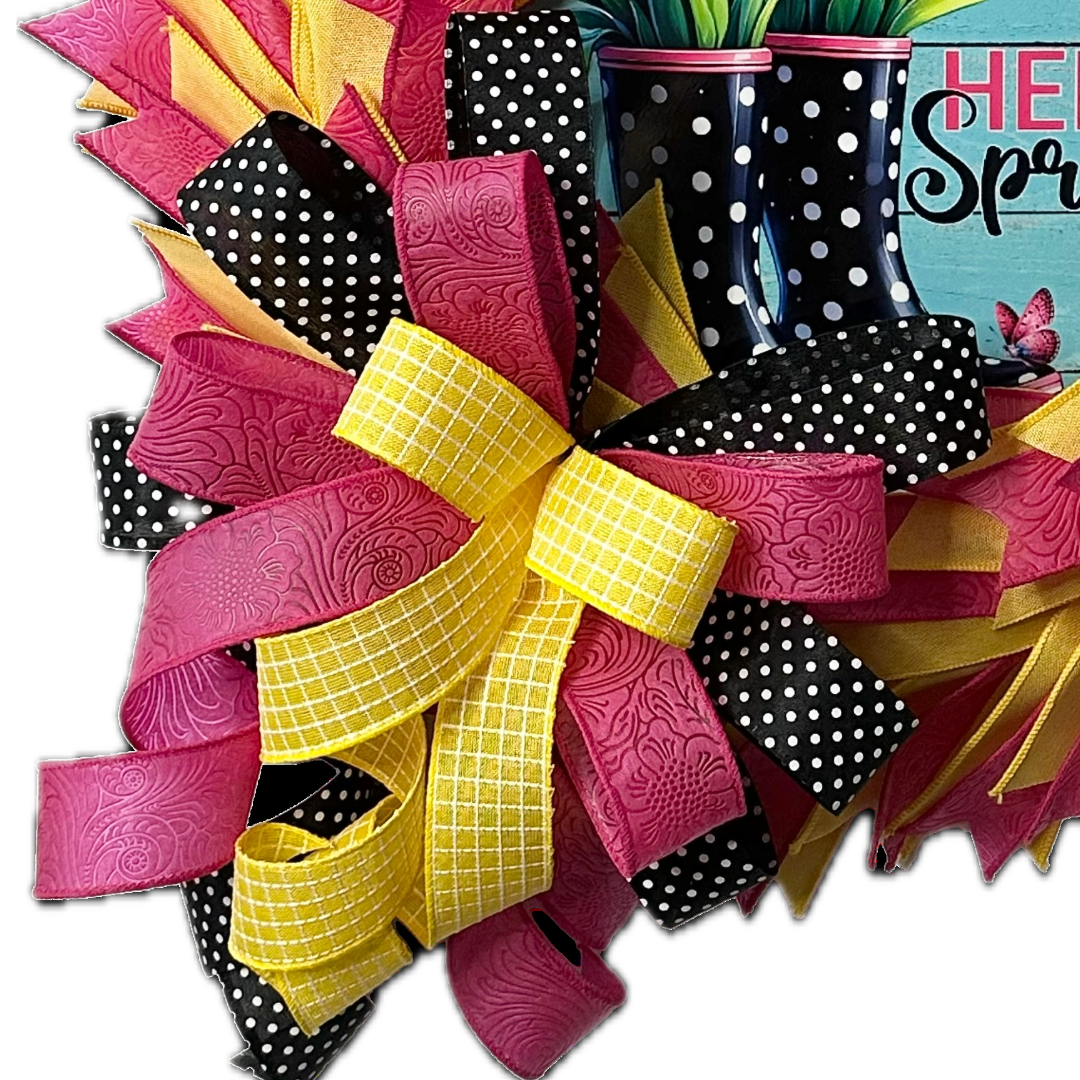 Dollar Tree all ribbon wreath featuring spring themed elements and a large ribbon bow