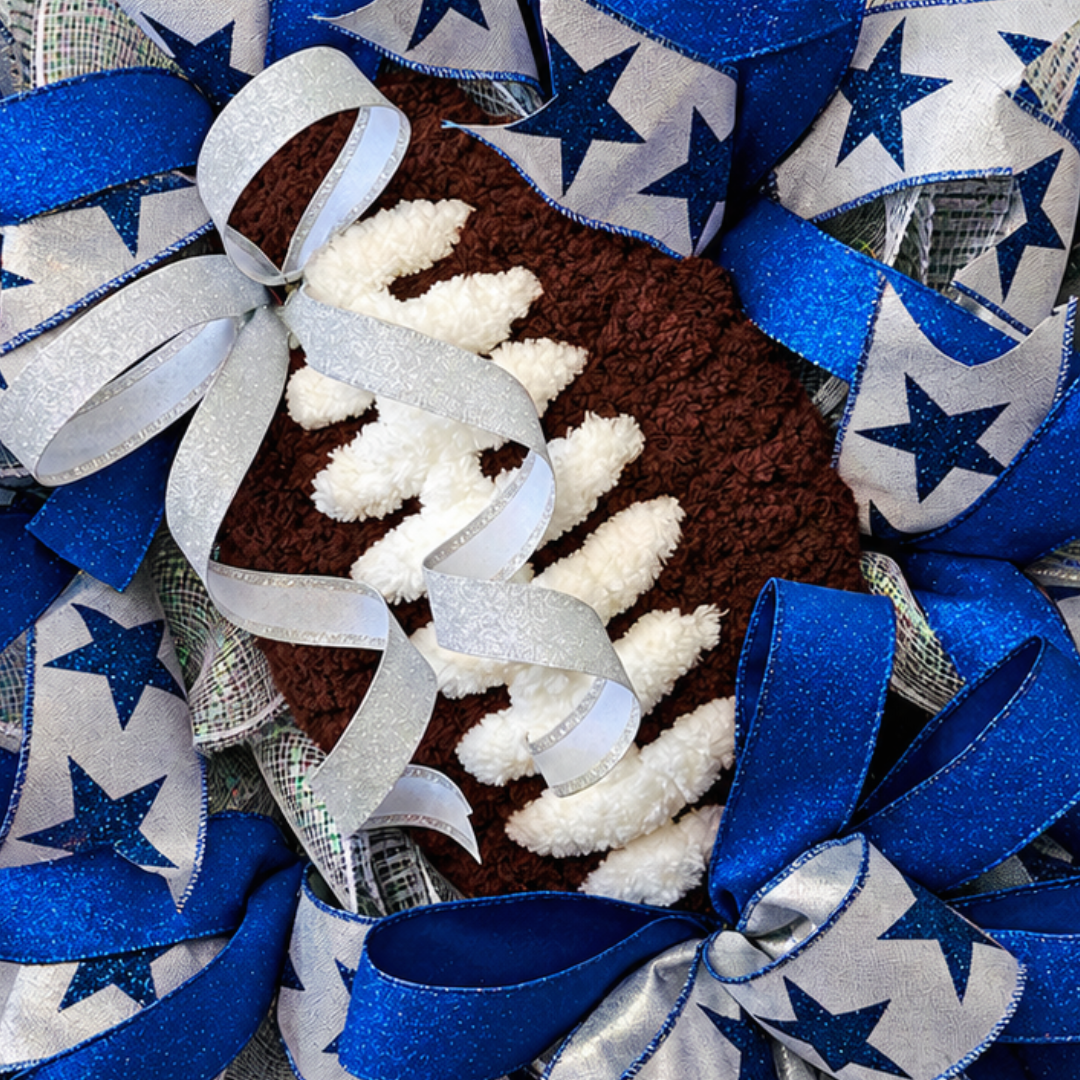 Royal blue, silver and grey deco mesh and wired ribbon wreath featuring stars and a chunky yarn football center by Monkey's Creations. 