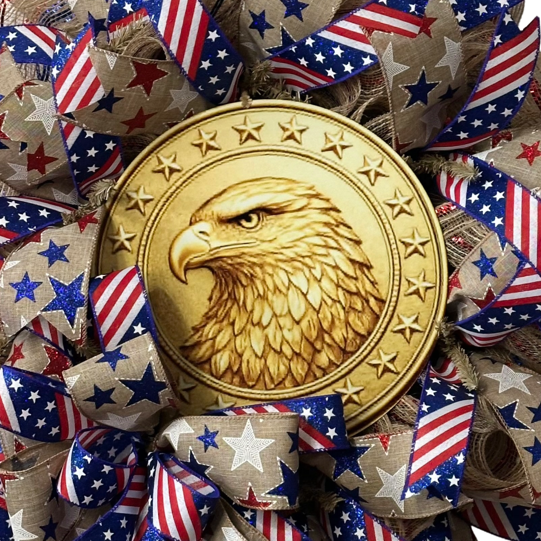 Deco mesh wreath with a golden eagle wreath sign surrounded by American flags themed ribbon