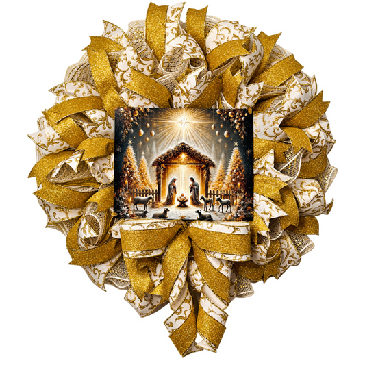 A gold and creme deco mesh and ribbon wreath featuring a golden nativity scene by Monkey's Creations. 