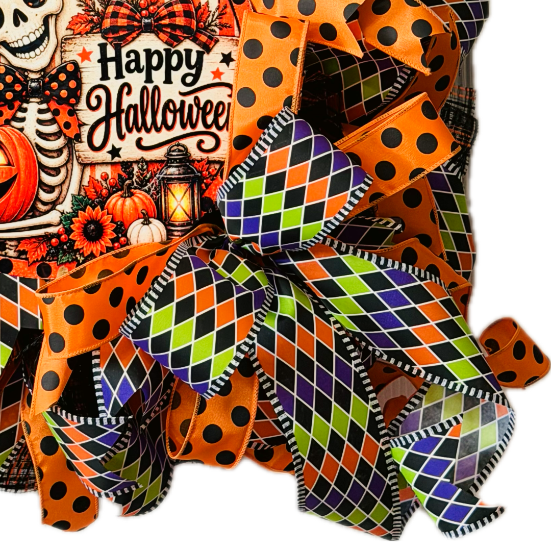 Orange, purple, black and lime green Halloween deco mesh and ribbon wreath featuring a round dapper skeleton with "happy Halloween" metal wreath sign and a large ribbon bow by Monkey's Creations. 