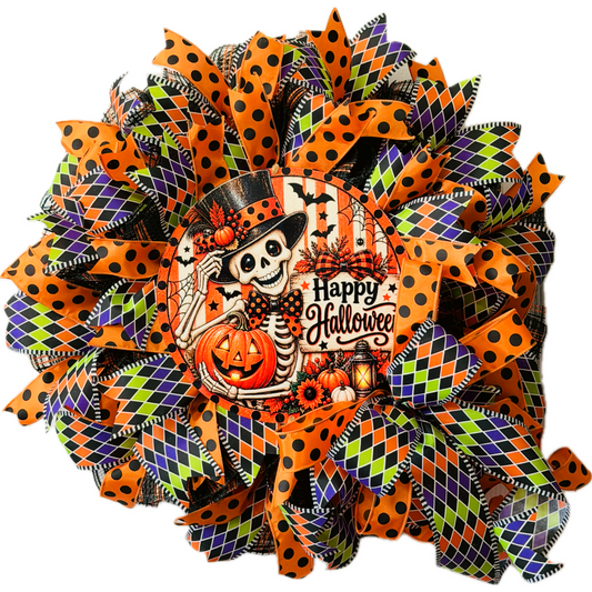Orange, purple, black and lime green Halloween deco mesh and ribbon wreath featuring a round dapper skeleton with "happy Halloween" metal wreath sign and a large ribbon bow by Monkey's Creations. 