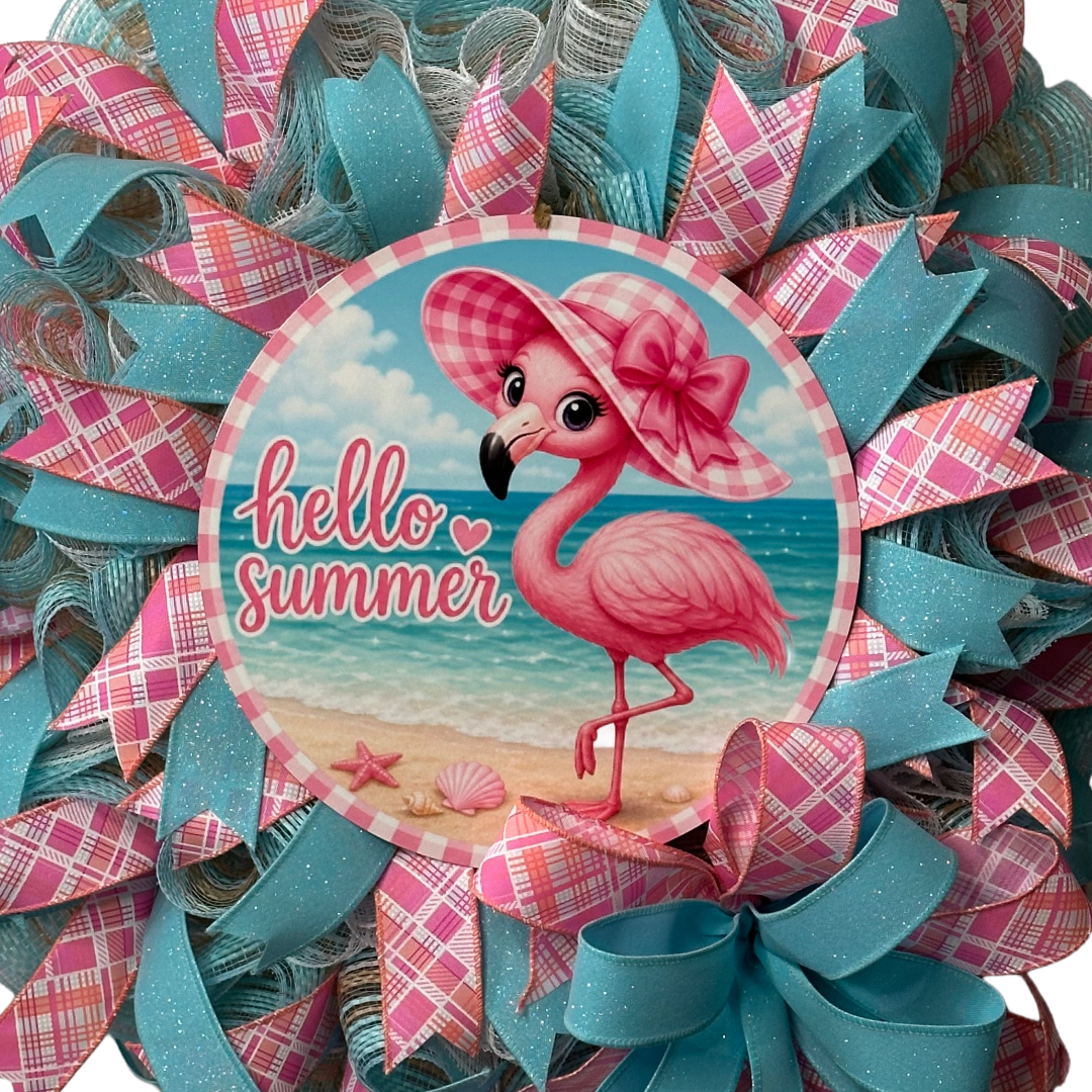 Deco mesh and ribbon wreath with a pink flamingo and 'hello summer' metal wreath sign center by Monkey's Creations. 