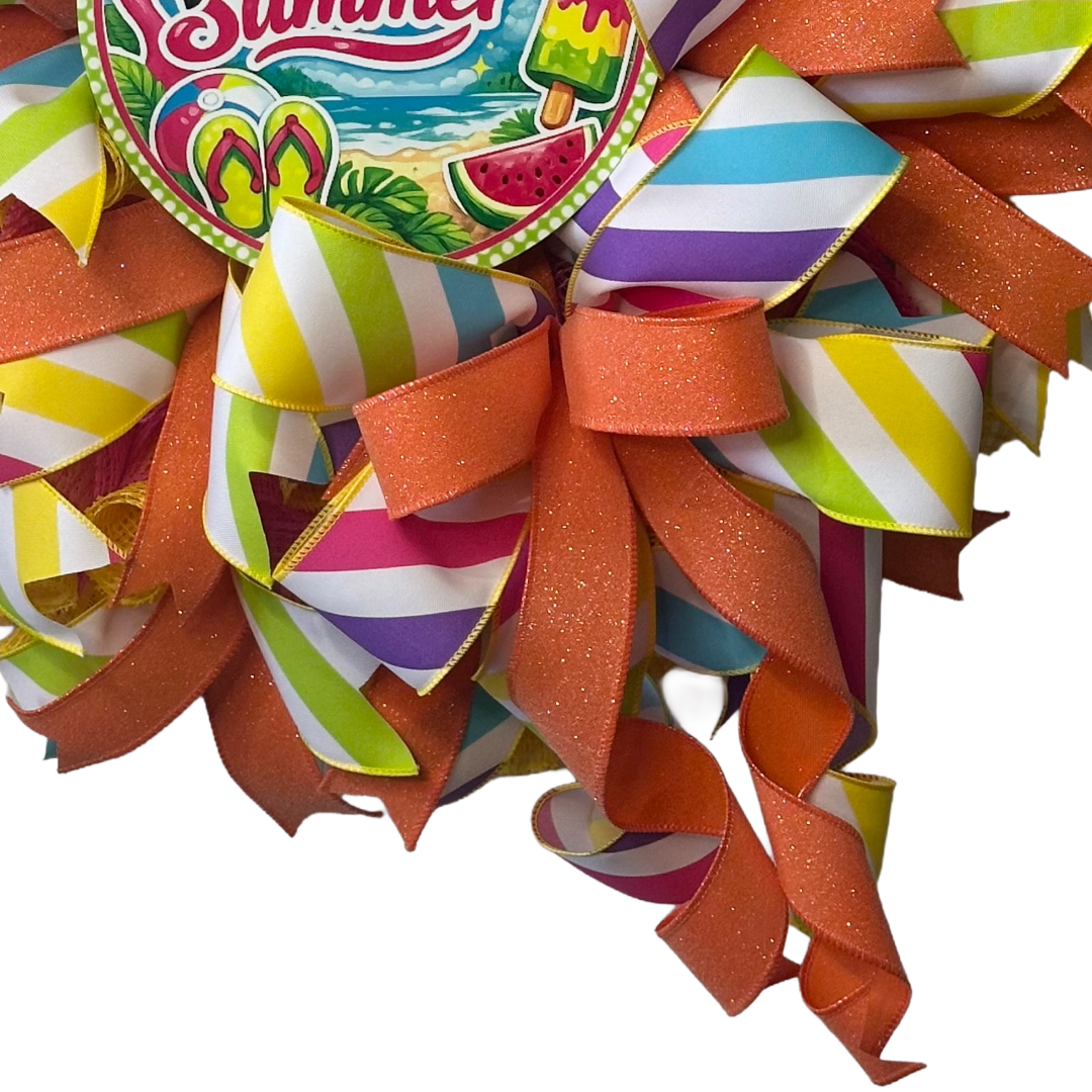 Colorful deco mesh and ribbon wreath with summer-themed elements and a 'Hello Summer' metal wreath sign center.