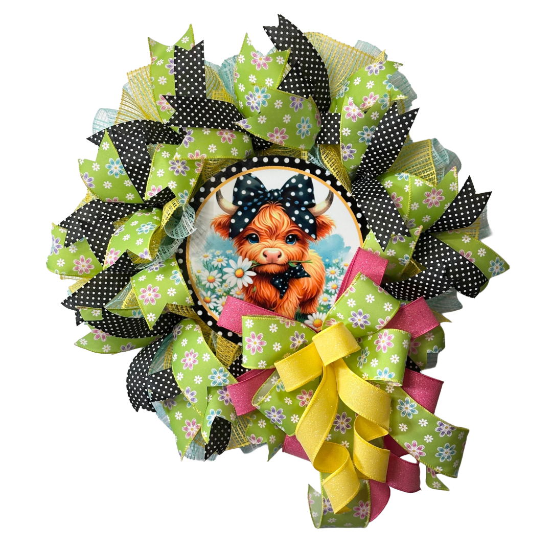 Farmhouse deco mesh and ribbon wreath with a highland cow center by Monkey's Creations. 