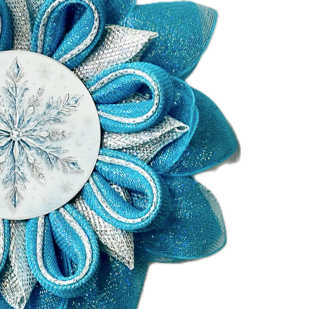 Ice blue and silver deco mesh snowflake made with a metal snowflake center by Monkey's Creations. 