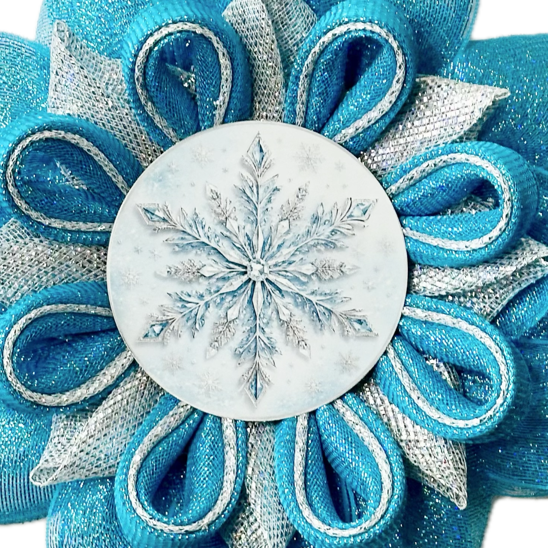 Ice blue and silver deco mesh snowflake made with a metal snowflake center by Monkey's Creations. 