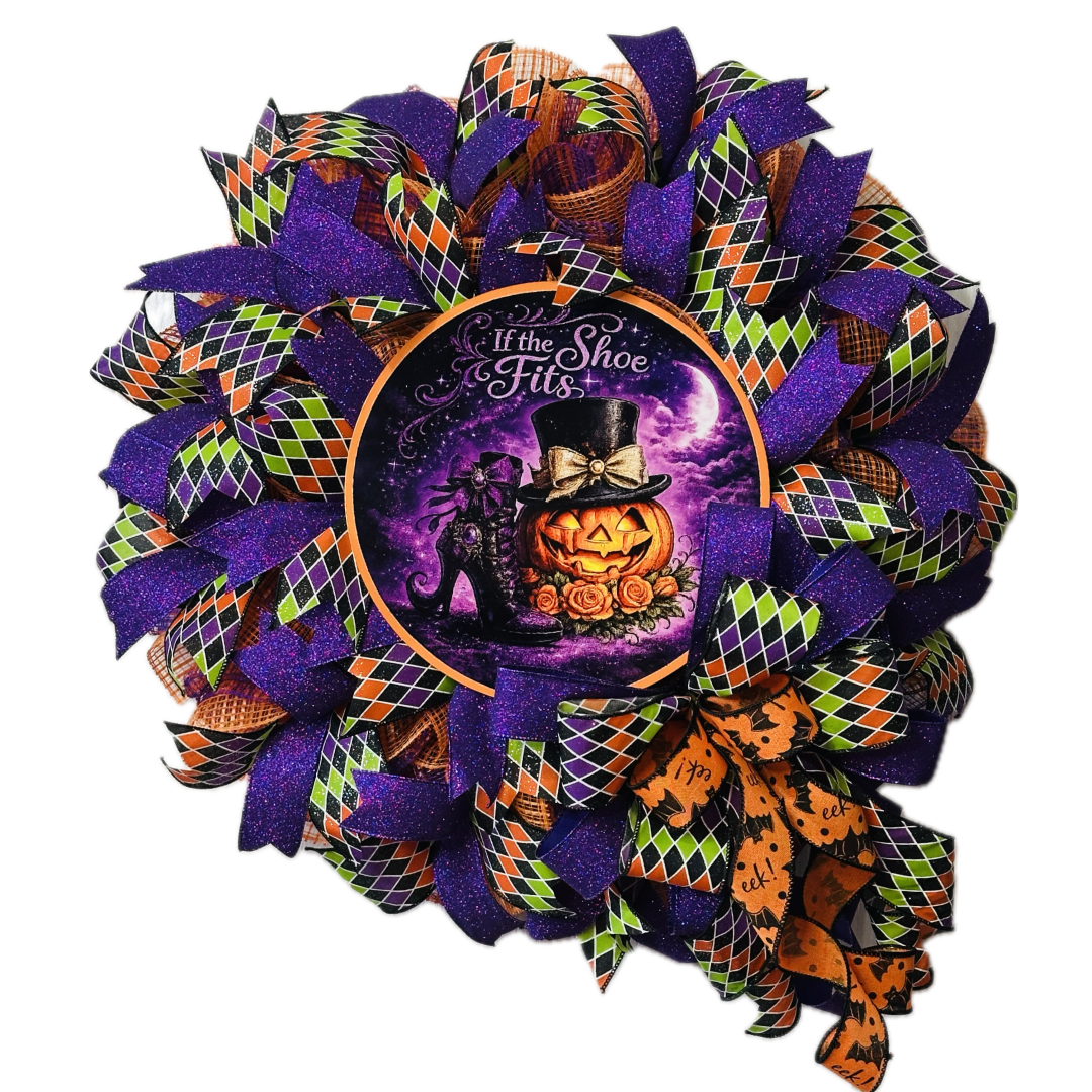 Orange, purple, green and black Halloween deco mesh and ribbon wreath featuring colorful bow and a metal wreath sign with the text "if the shoe fits" by Monkey's Creations.