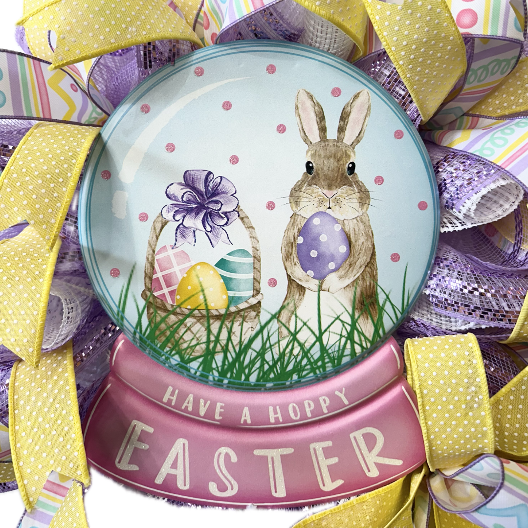 Easter-themed decorative wreath sign with bunny and eggs, surrounded by colorful ribbons.